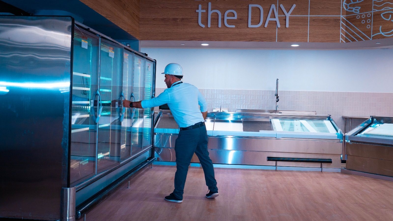 Refrigerated display cases holding food at safe storage temperatures in a supermarket