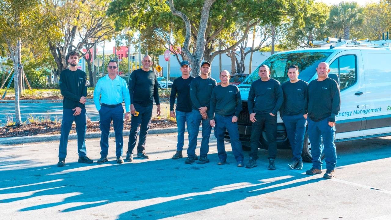 Dynamiq team gathered outside the company's offices in Doral, Florida